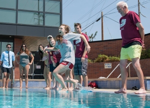 Associated Students President Taylor Herren (left) takes the first leap as Chico State President Paul Zingg (right) along with students took the plunge into the pool at the Wildcat Recreation Center (WREC) as part of the Wildcat Way version of the ALS Ice Bucket Challenge event Monday, September 1, 2014 in Chico, Calif. 
